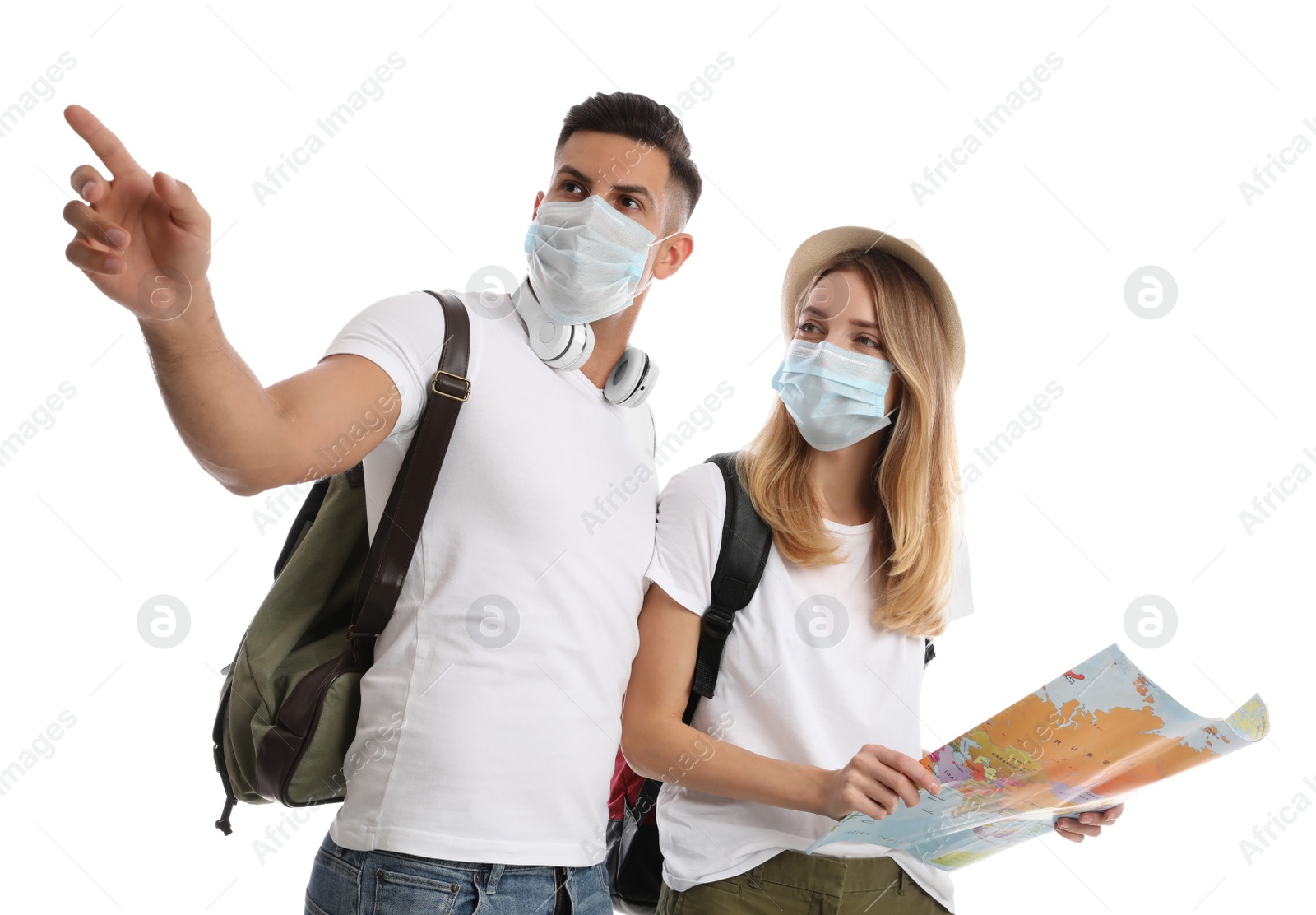 Photo of Couple in face masks with map on white background. Summer travel