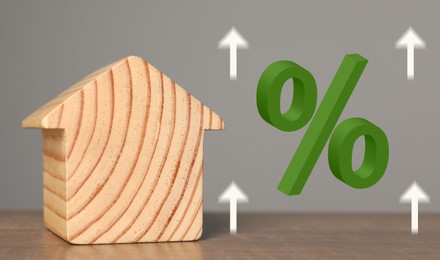 Image of Mortgage rate. Wooden model of house, arrows and percent sign, banner design