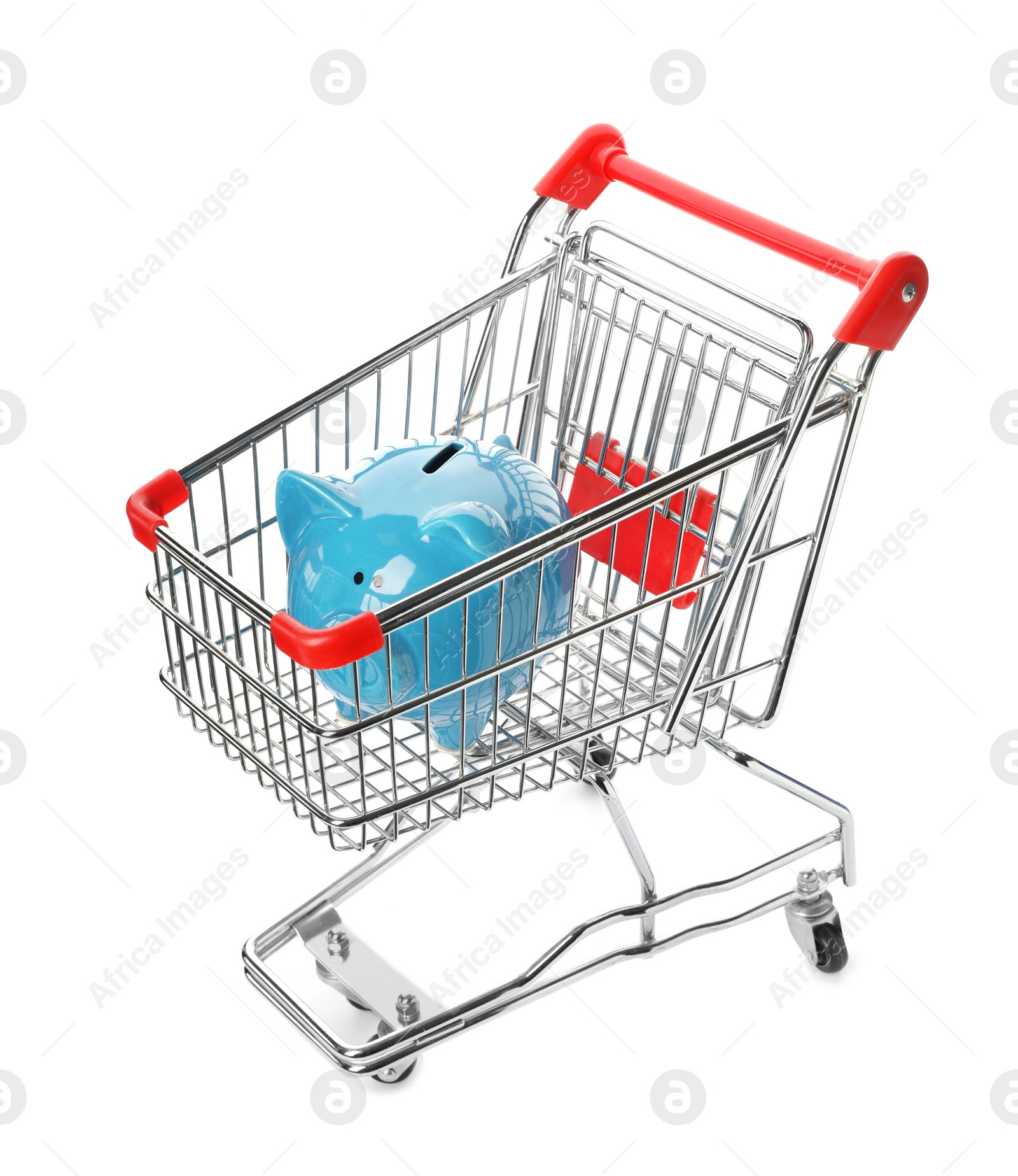 Photo of Piggy bank in shopping cart isolated on white