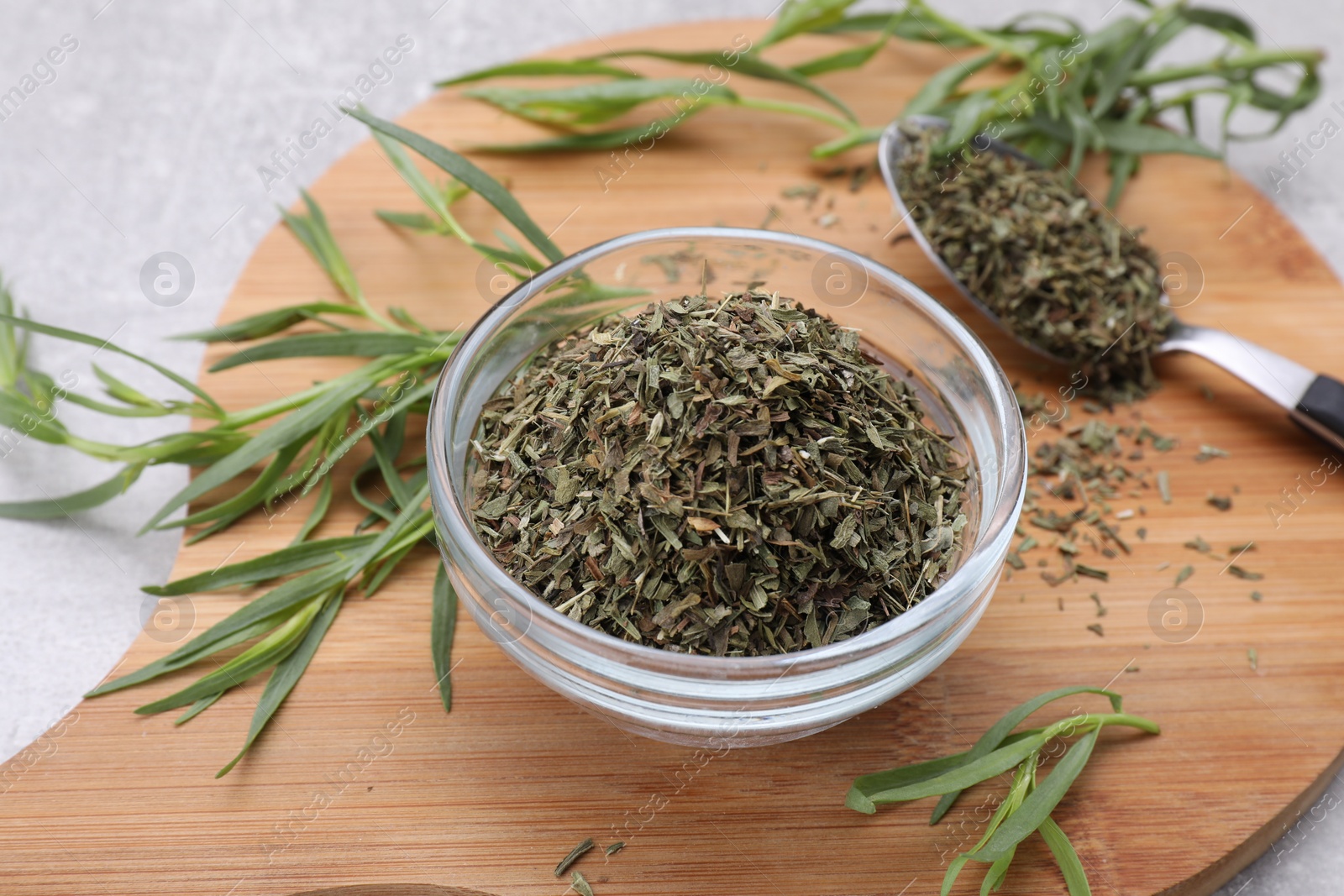 Photo of Dry and fresh tarragon on table, closeup