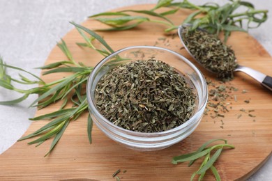 Dry and fresh tarragon on table, closeup