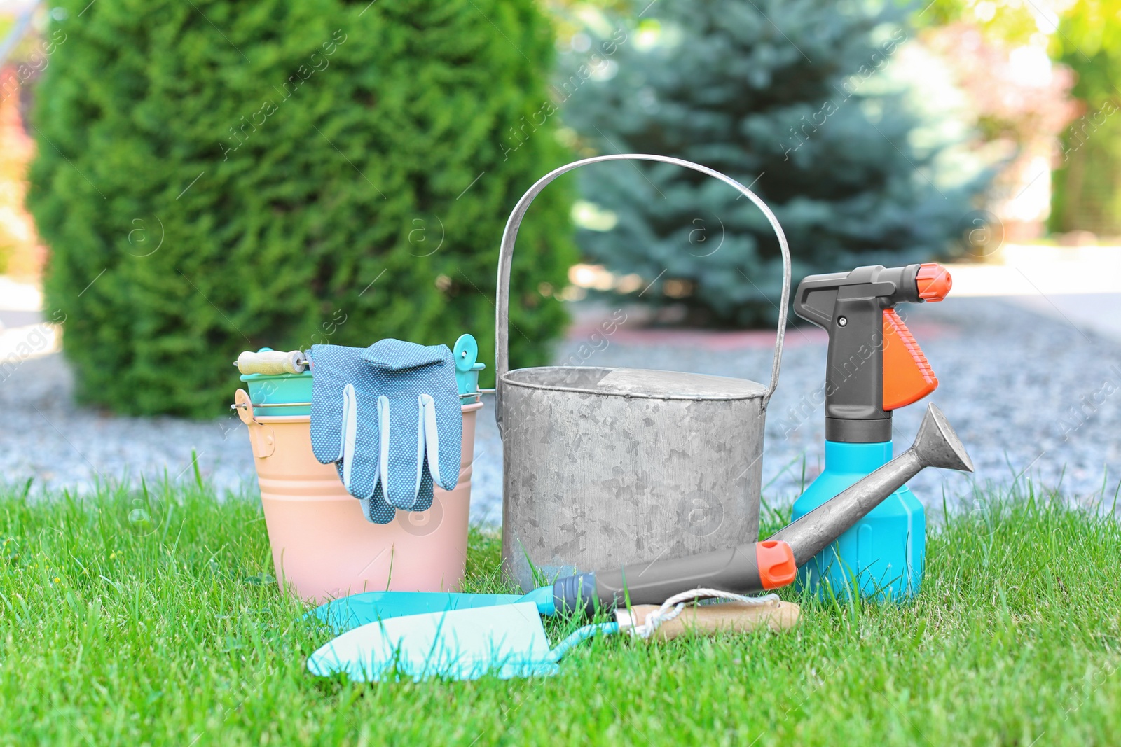 Photo of Set of gardening tools on green grass