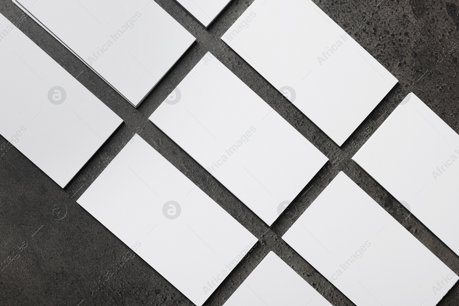 Photo of Blank business cards on grey textured background, top view. Mockup for design