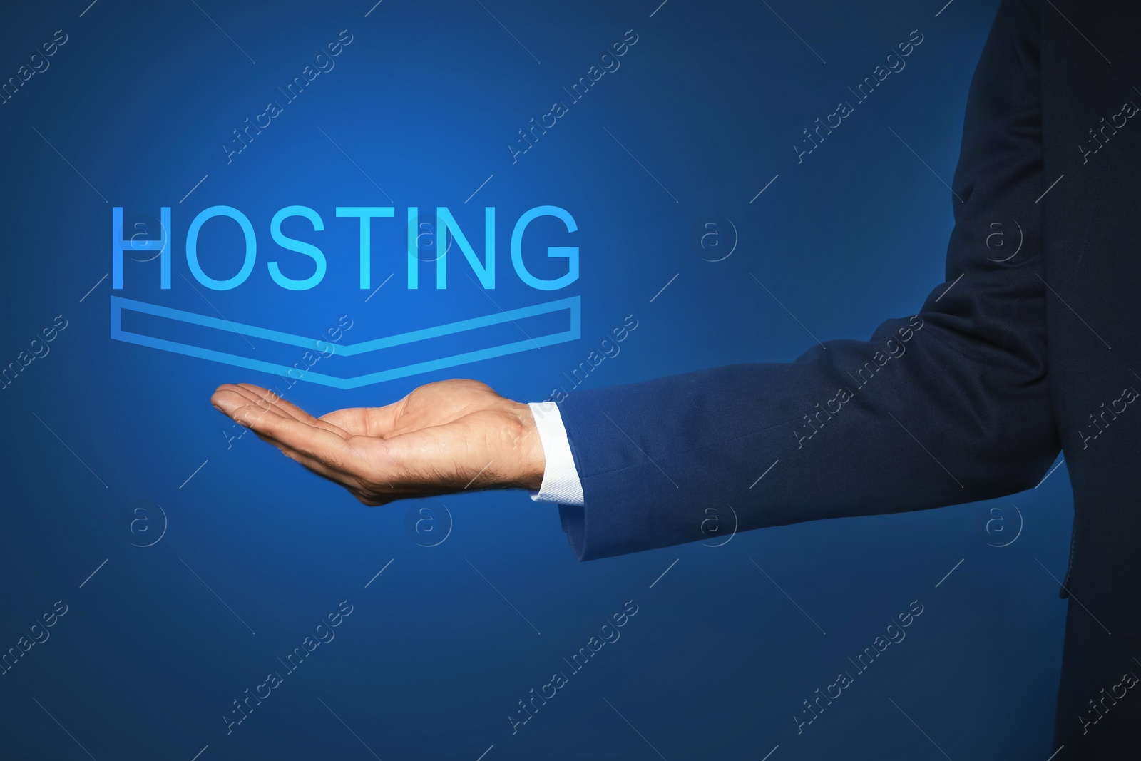 Image of Man showing virtual model of word HOSTING against blue background, closeup