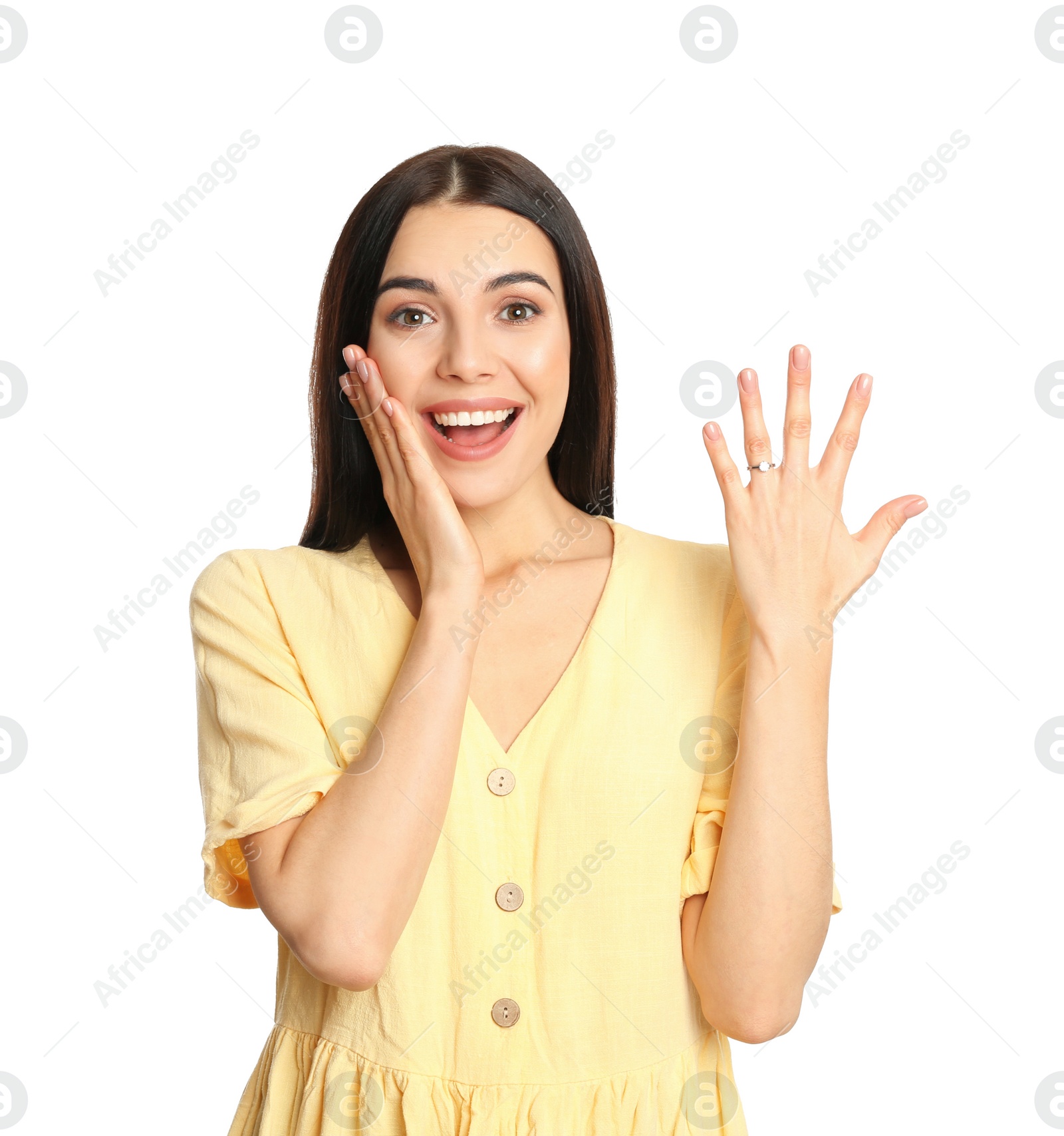 Photo of Happy young woman wearing beautiful engagement ring on white background