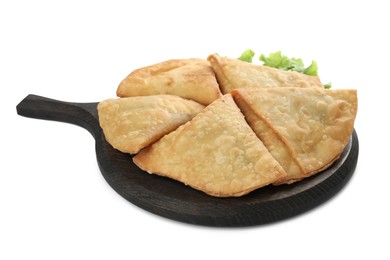 Photo of Fresh delicious crispy samosas and lettuce on white background