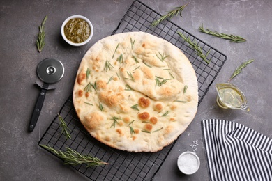 Photo of Flat lay composition with focaccia bread on grey table