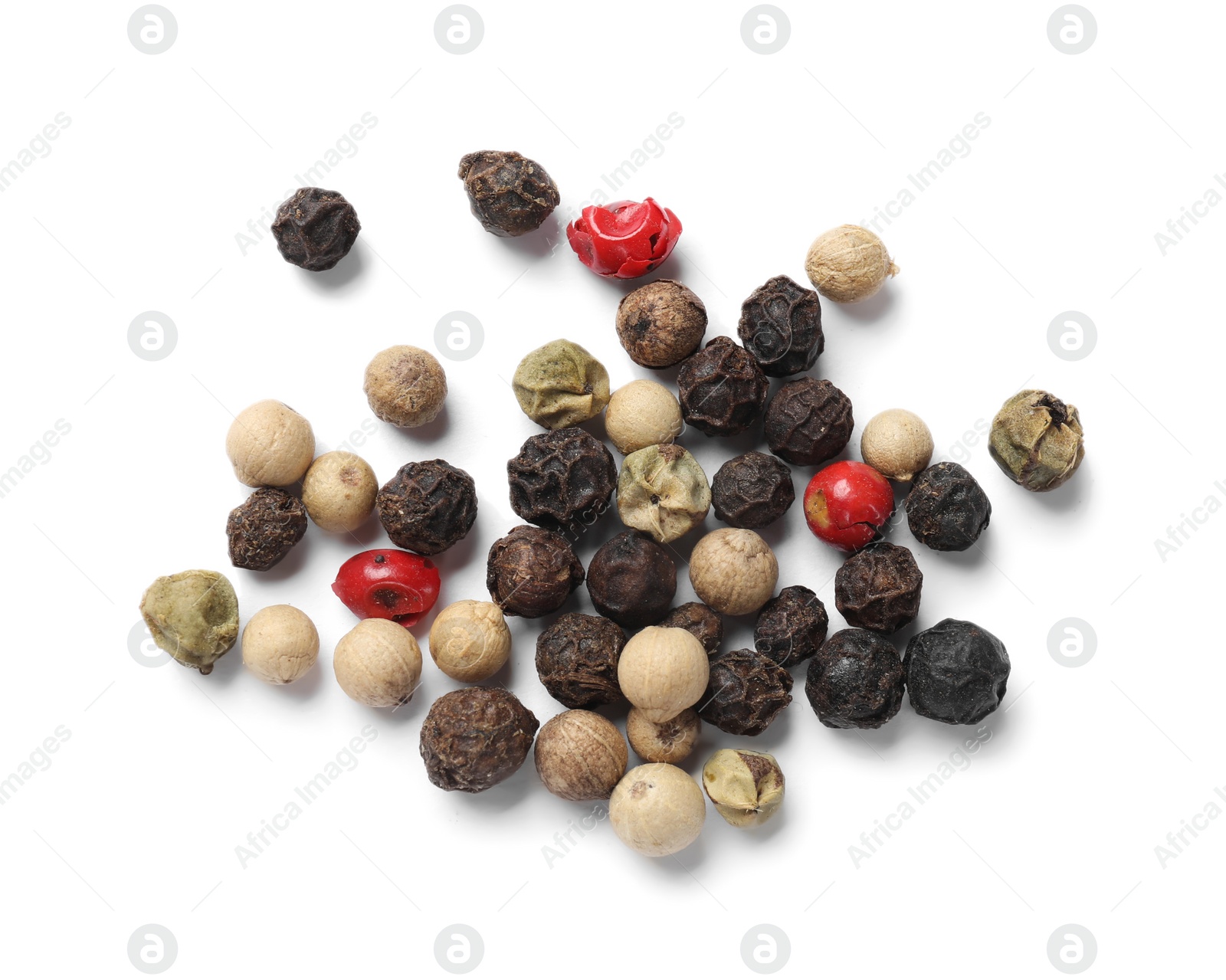 Photo of Aromatic spices. Pile of different peppers isolated on white, top view