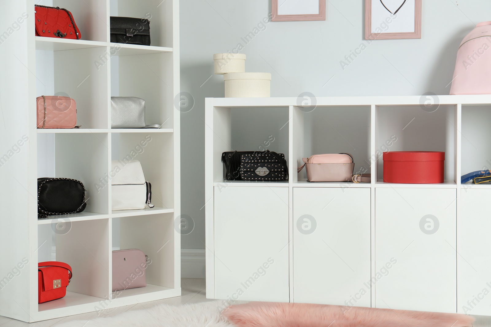 Photo of Wardrobe shelves with different stylish bags indoors. Idea for interior design