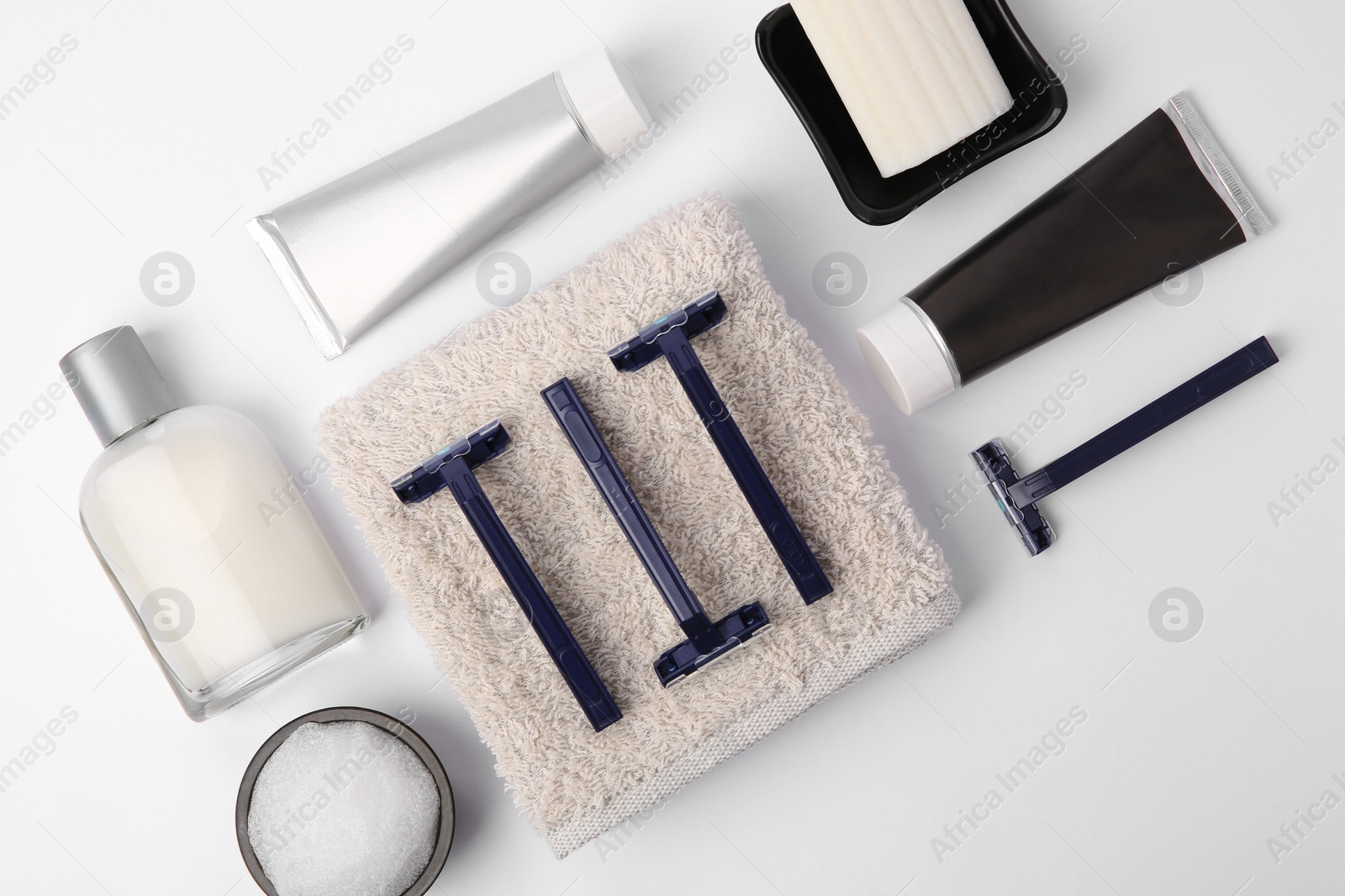 Photo of Different men's shaving accessories on white background, flat lay