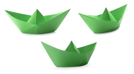 Image of Set with green paper boats on white background