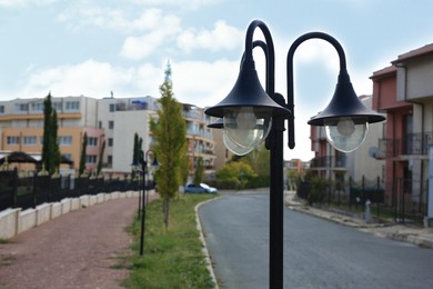 Beautiful vintage street light in city on autumn day