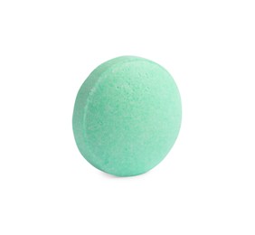 Photo of One light green pill on white background. Medicinal treatment
