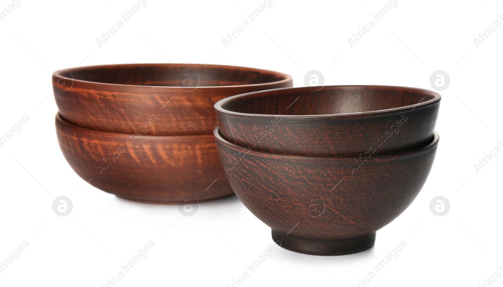 Photo of Stylish brown clay bowls on white background