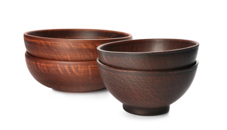 Stylish brown clay bowls on white background