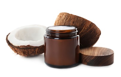 Photo of Jar of hand cream and coconut on white background