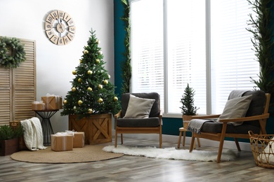 Beautiful interior with decorated Christmas tree in living room