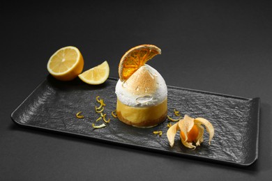 Photo of Beautiful composition of delicious dessert on black background. Food stylist