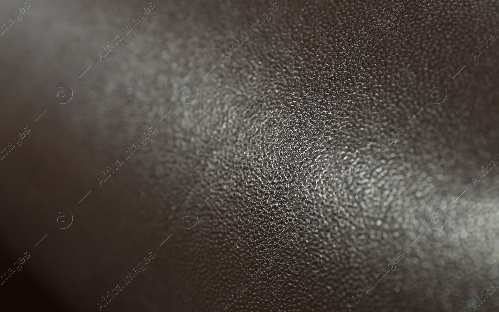 Photo of Dark brown natural leather as background, closeup view