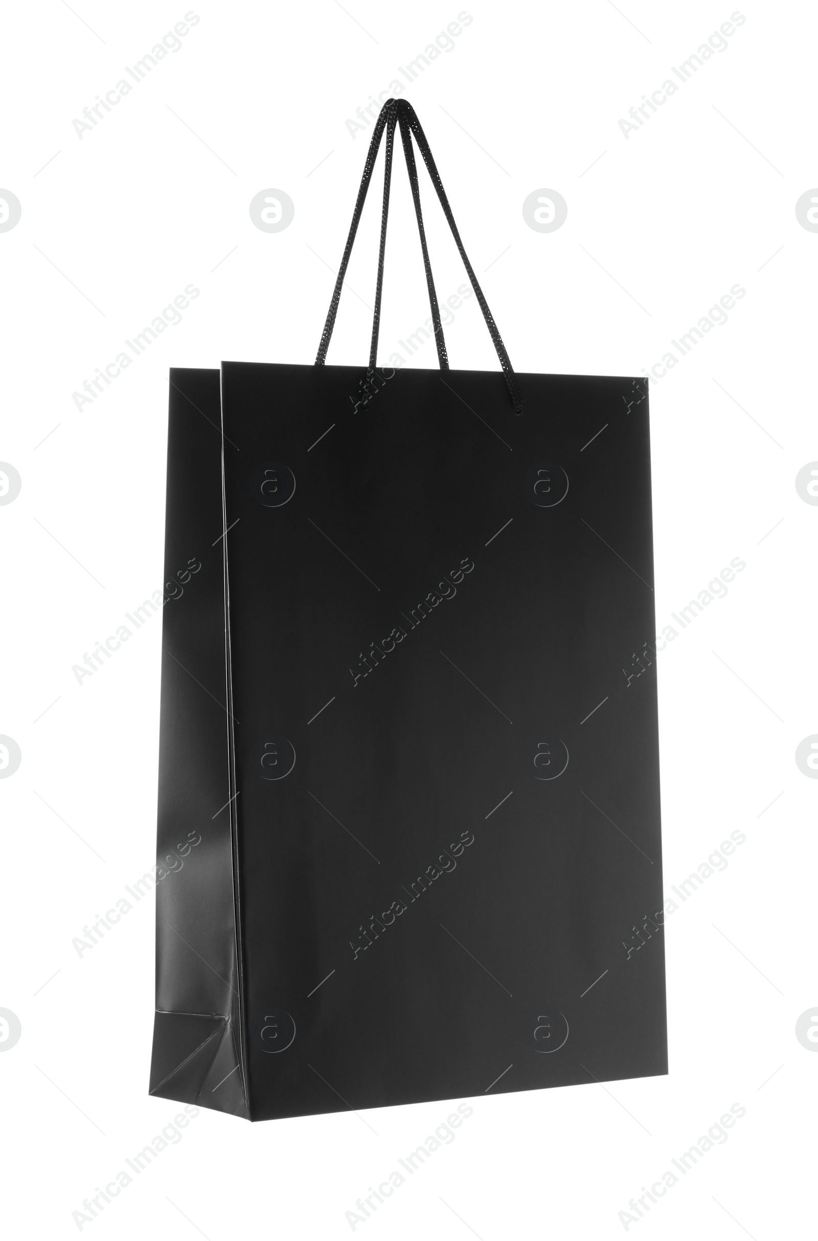 Photo of One black paper bag isolated on white