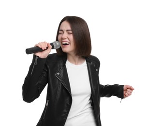 Beautiful young woman with microphone singing on white background