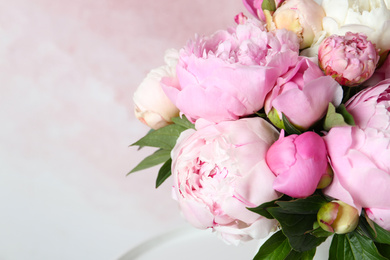 Photo of Bouquet of beautiful peonies on pink background, closeup