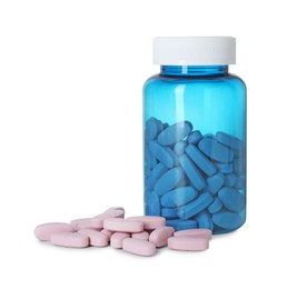 Photo of Bottle and pile of vitamin pills isolated on white