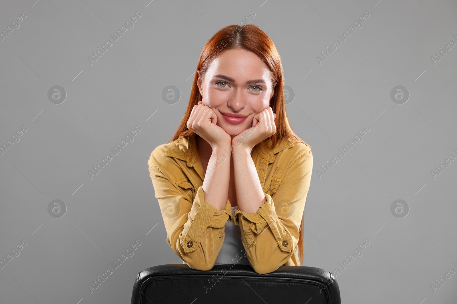 Photo of Casting call. Young woman performing on grey background