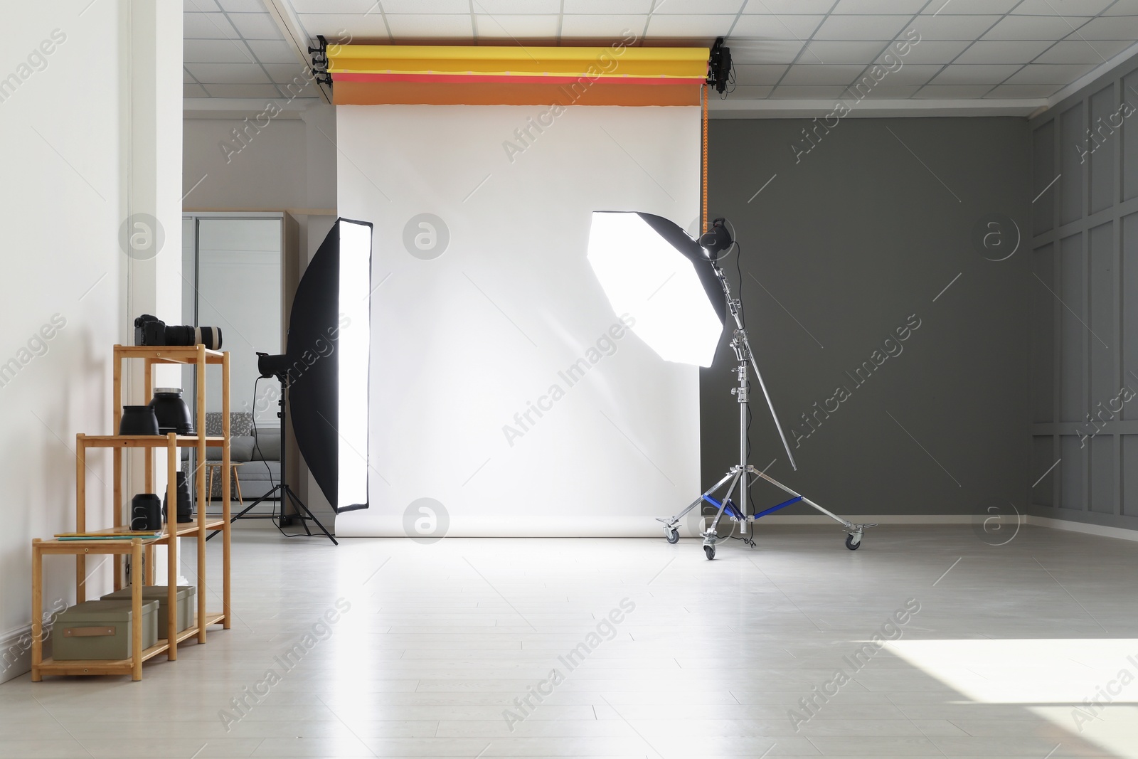 Photo of White photo background and professional lighting equipment in studio