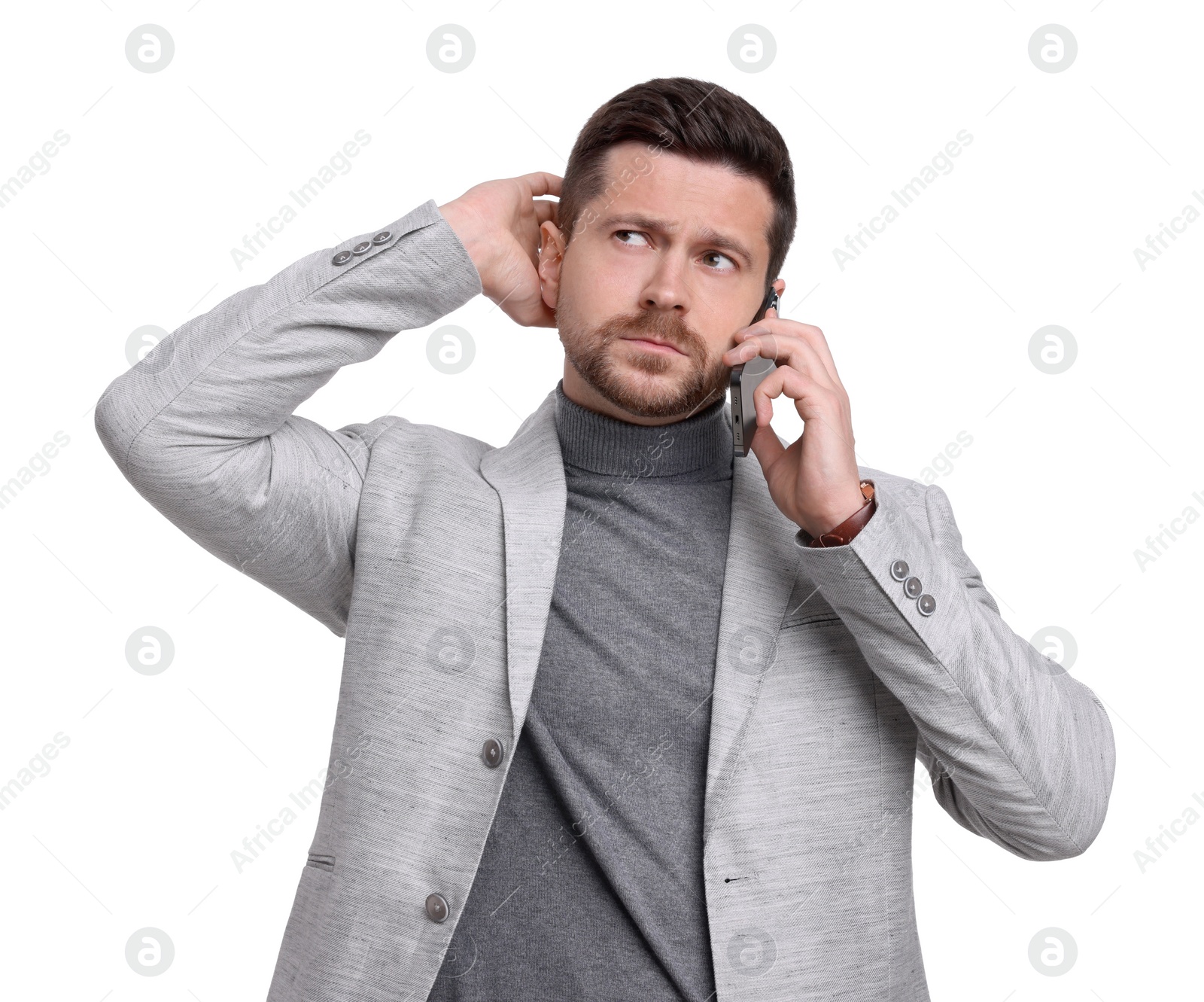 Photo of Handsome bearded businessman talking on smartphone against white background