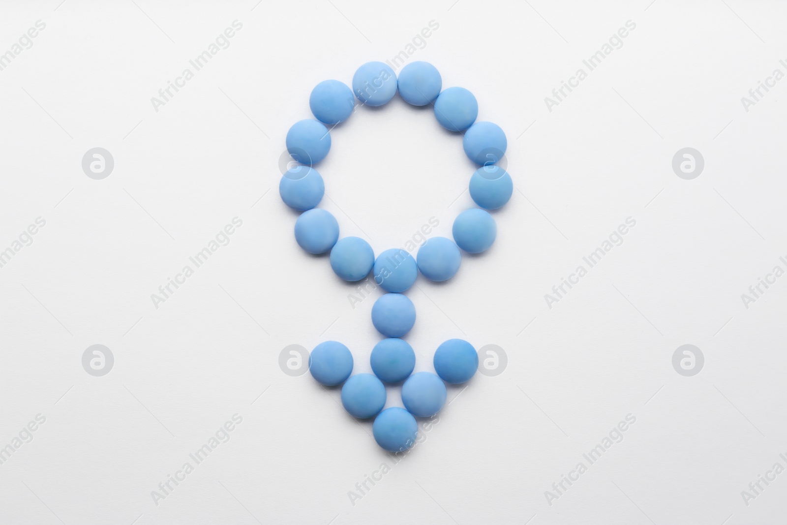 Photo of Male symbol made with pills on white background, flat lay. Potency problems