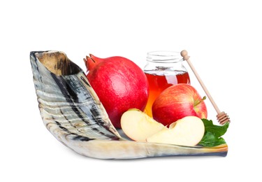 Photo of Honey, pomegranate, apples and shofar on white background. Rosh Hashana holiday