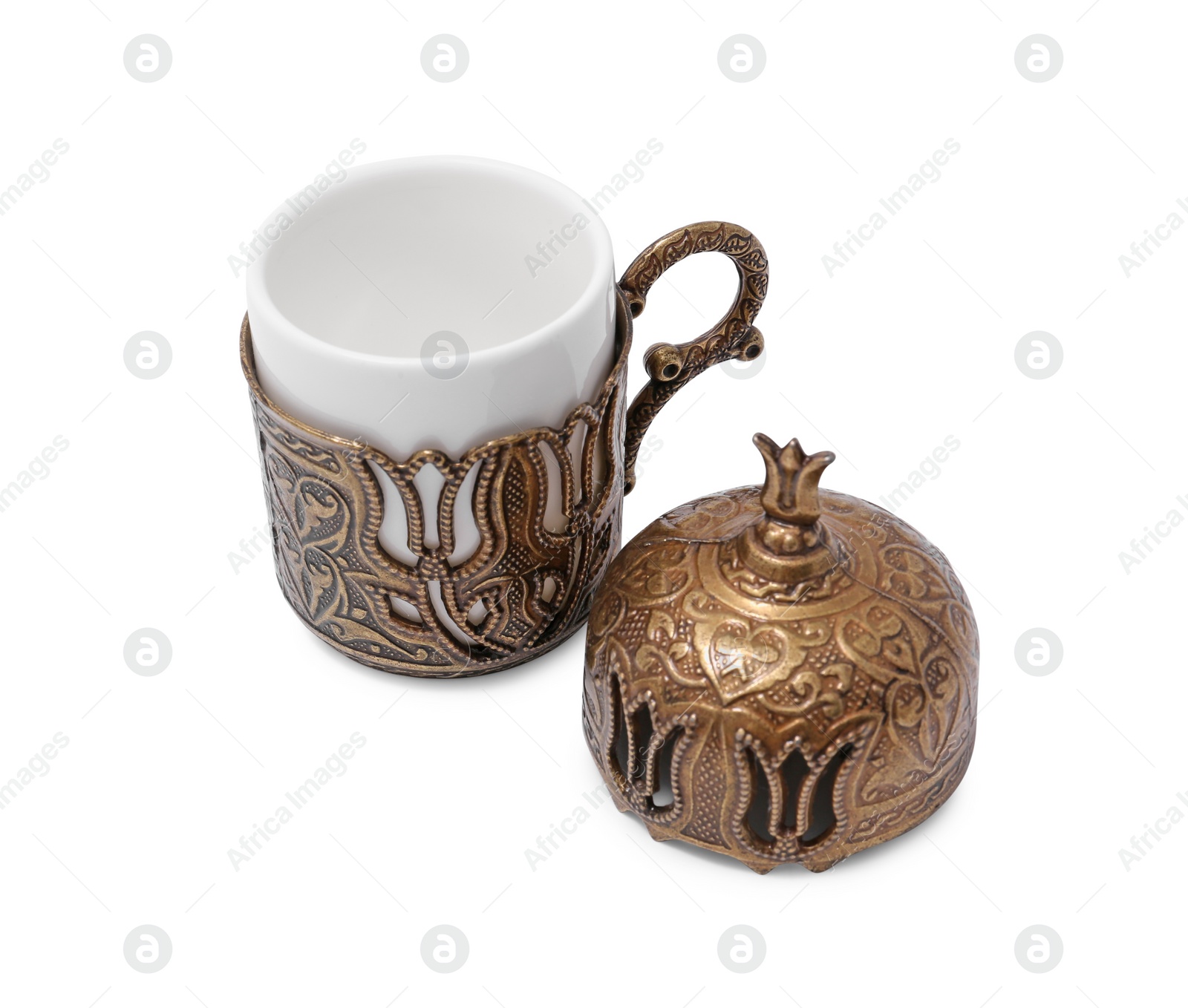 Photo of One ceramic cup in vintage holder and lid on white background