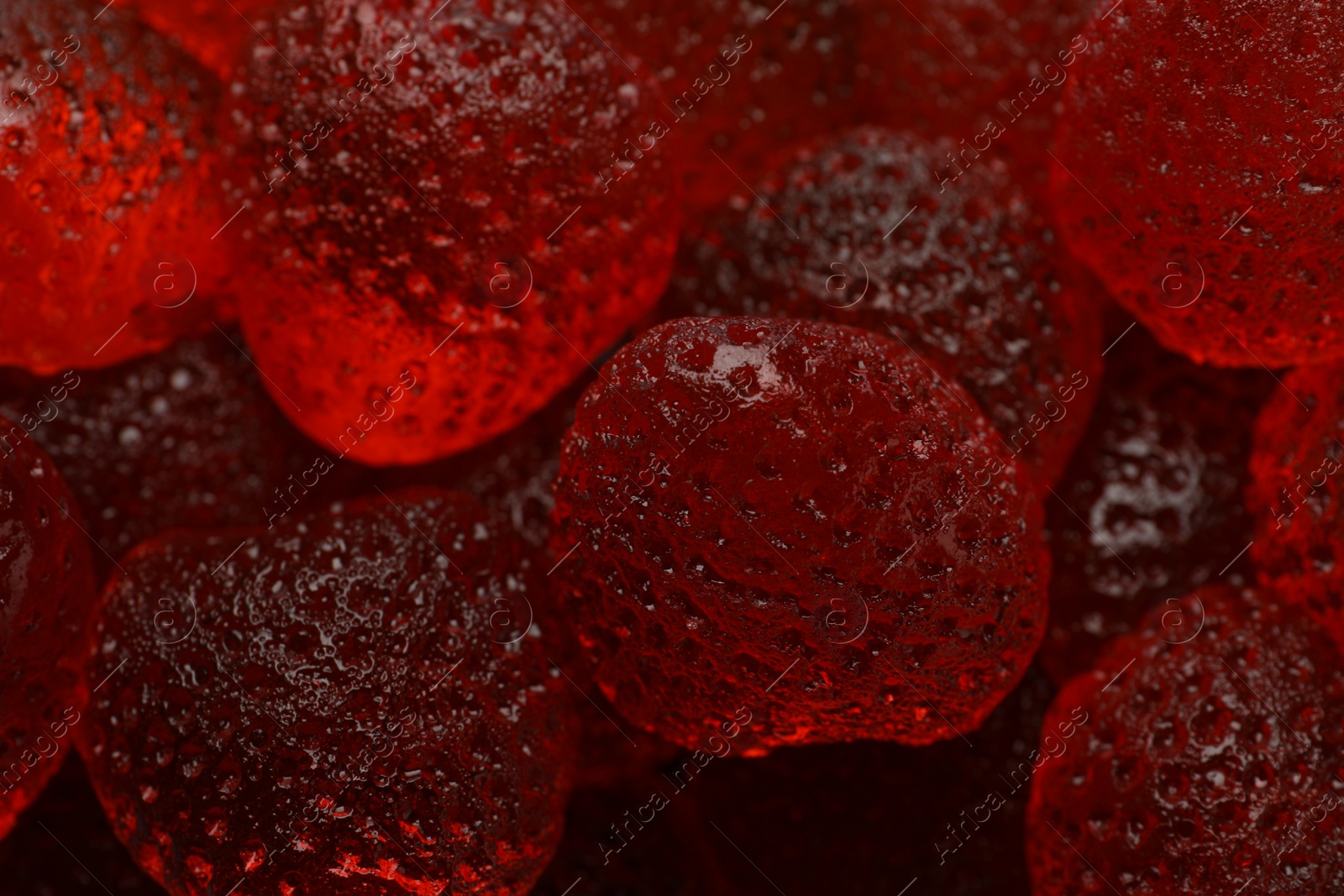 Photo of Delicious gummy strawberry candies as background, closeup