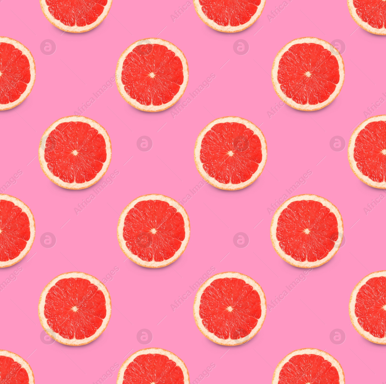 Image of Many fresh ripe slices of grapefruits on pink background, flat lay. Seamless pattern design