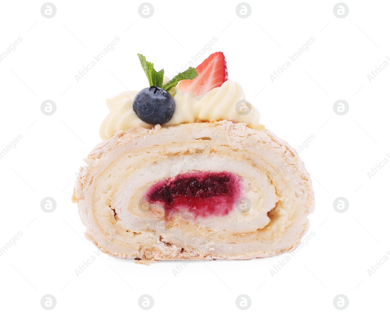 Photo of Slice of tasty meringue roll with jam, berries and mint leaves isolated on white