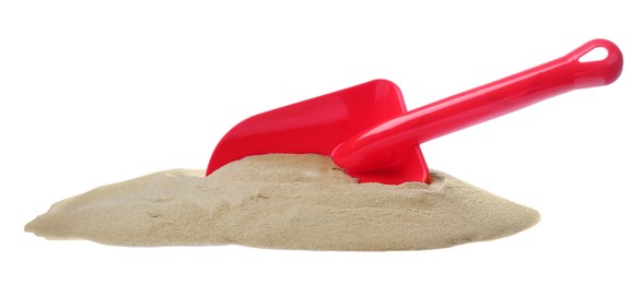 Photo of Pile of sand and red plastic toy shovel on white background