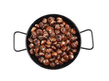Photo of Delicious roasted edible chestnuts in wok frying pan isolated on white, top view