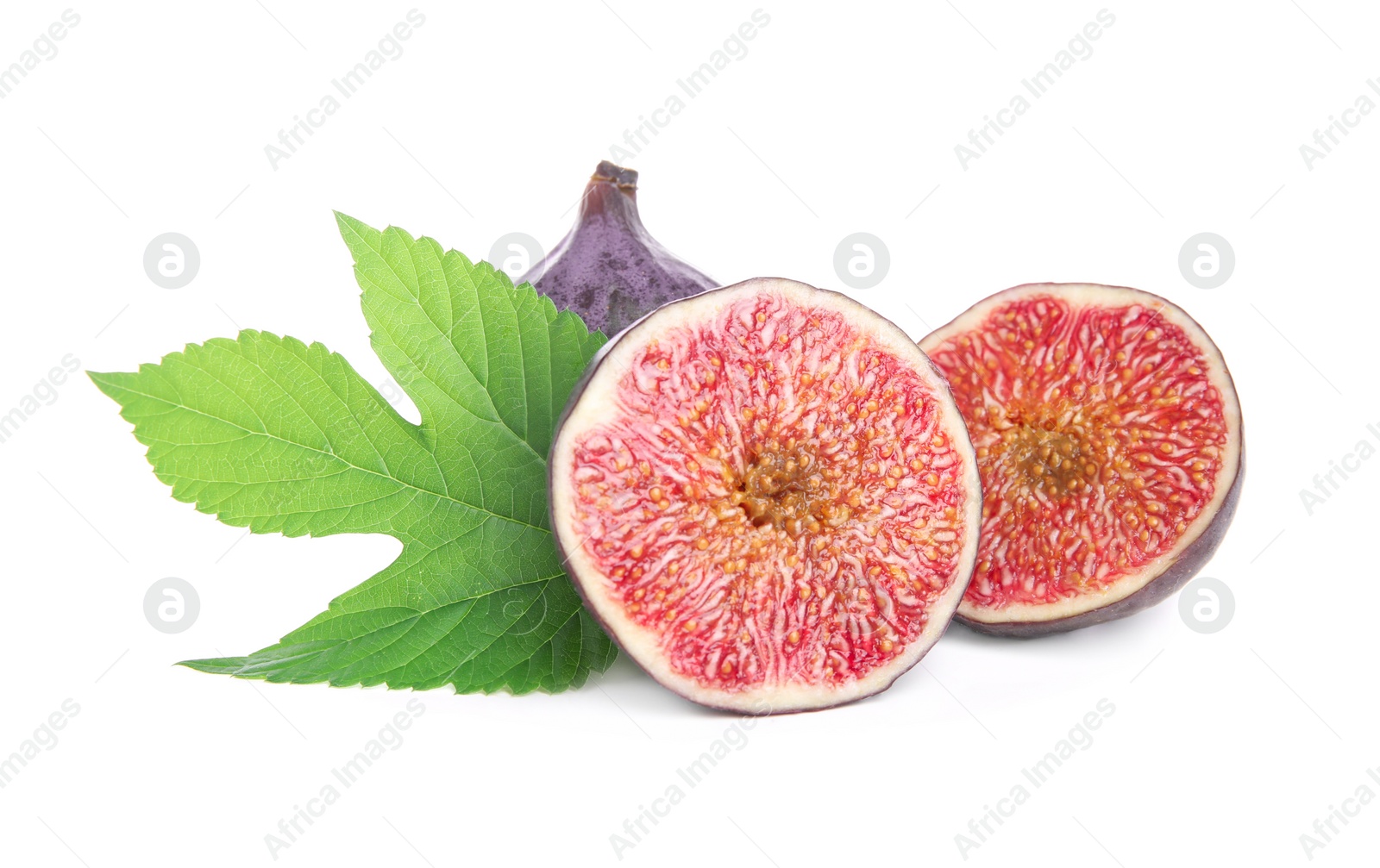 Photo of Whole and cut fresh ripe figs with green leaf isolated on white