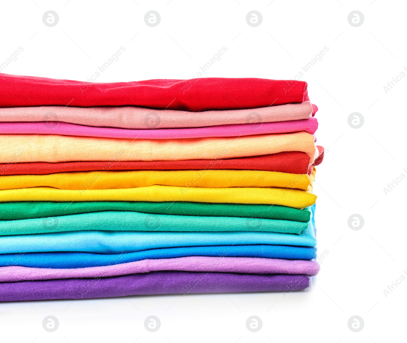 Photo of Stack of colorful t-shirts on white background