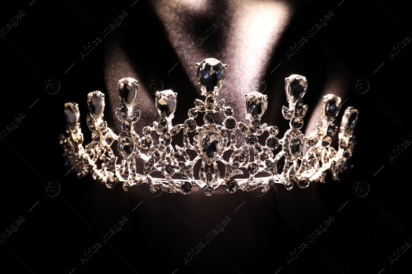 Photo of Beautiful silver tiara with diamonds on black cloth