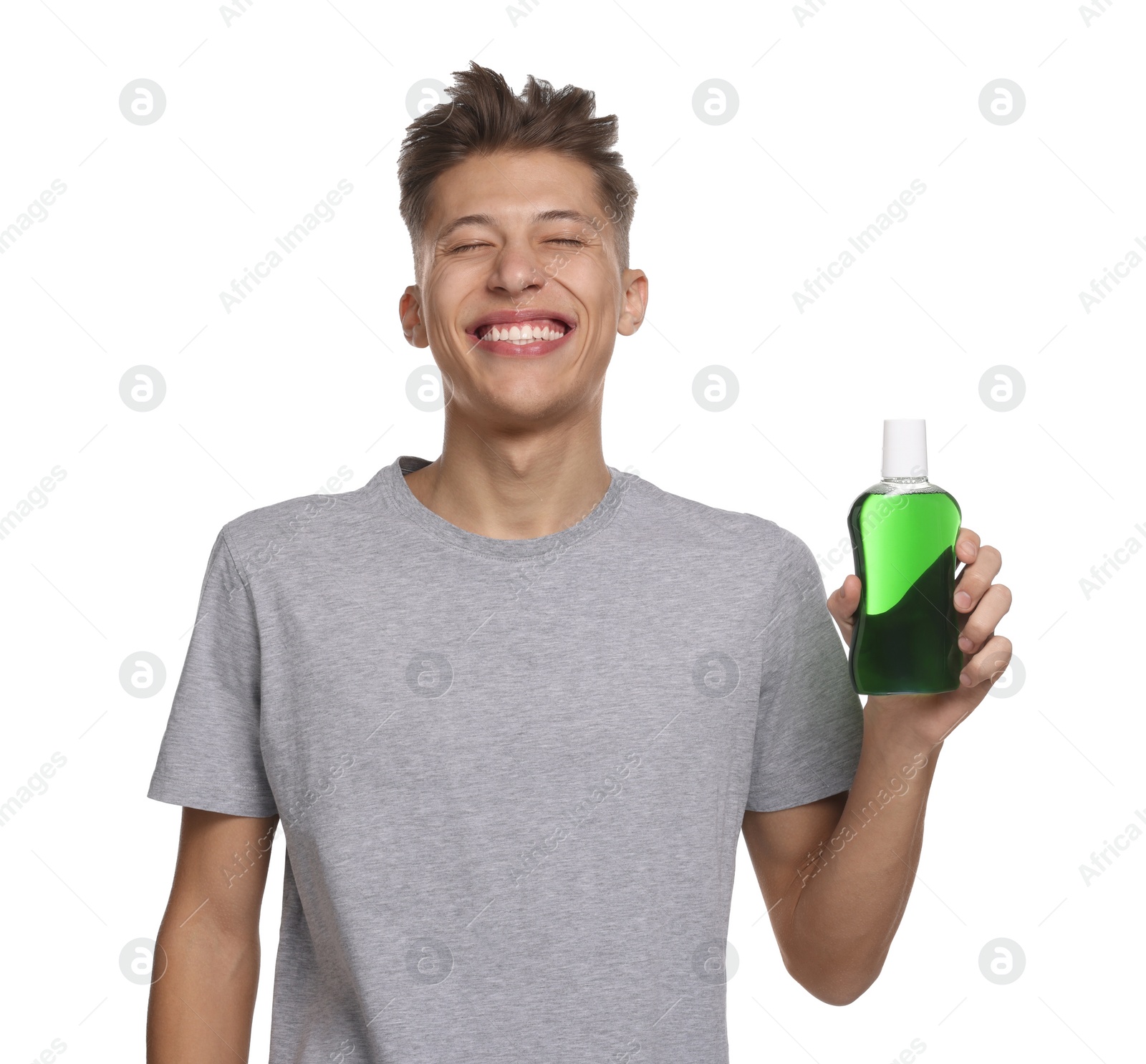 Photo of Young man with mouthwash on white background