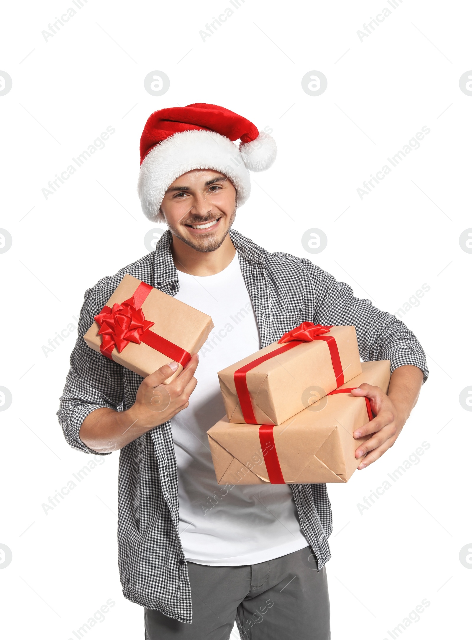 Photo of Young man with Christmas gifts on white background