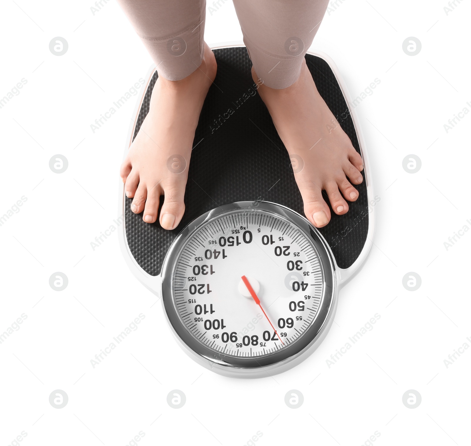 Photo of Pregnant woman standing on scales against white background, closeup