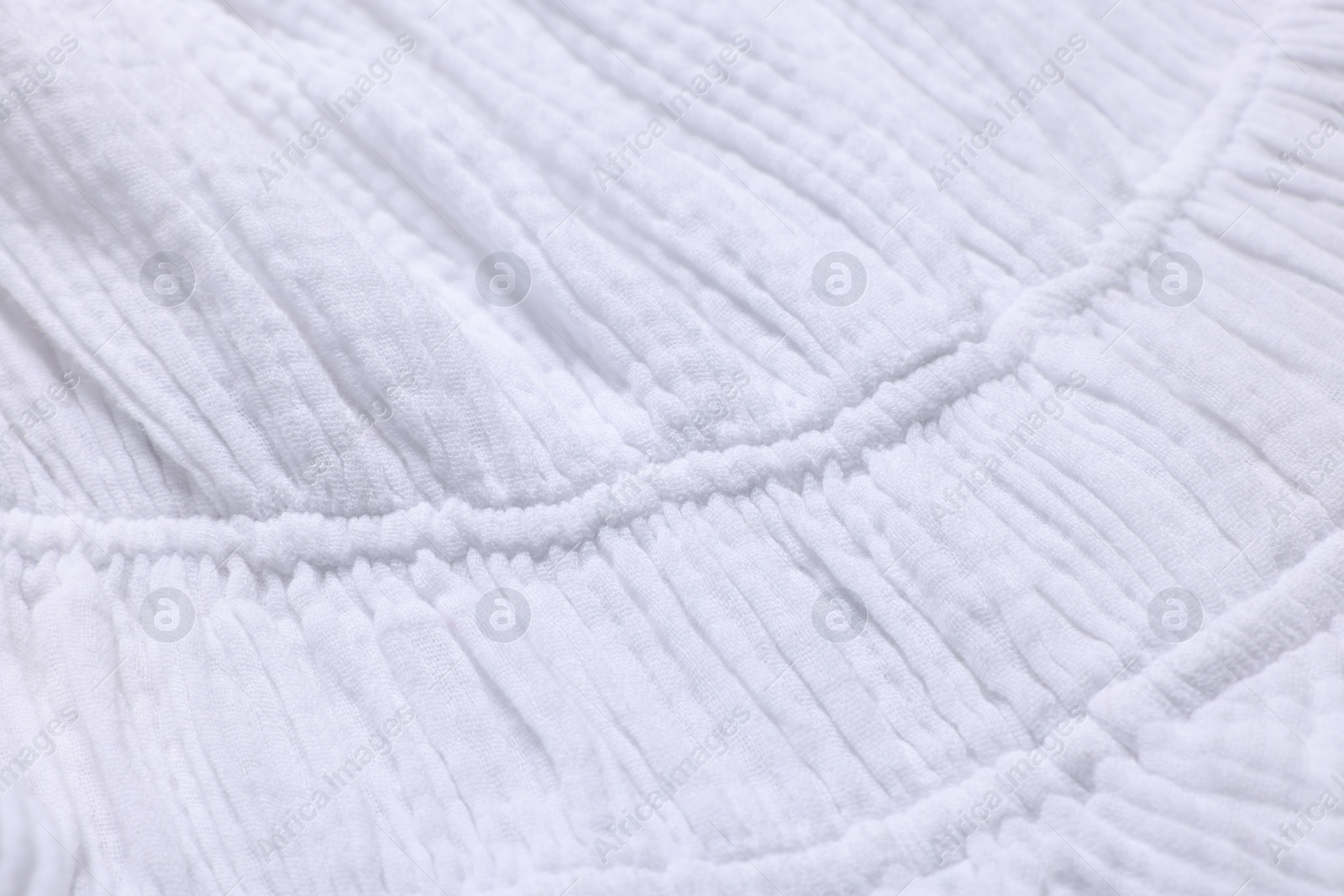 Photo of Texture of white fabric as background, closeup