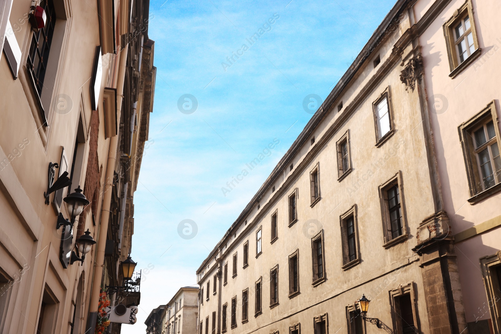 Photo of National flag of Ukraine on building facade, low angle view. Space for text