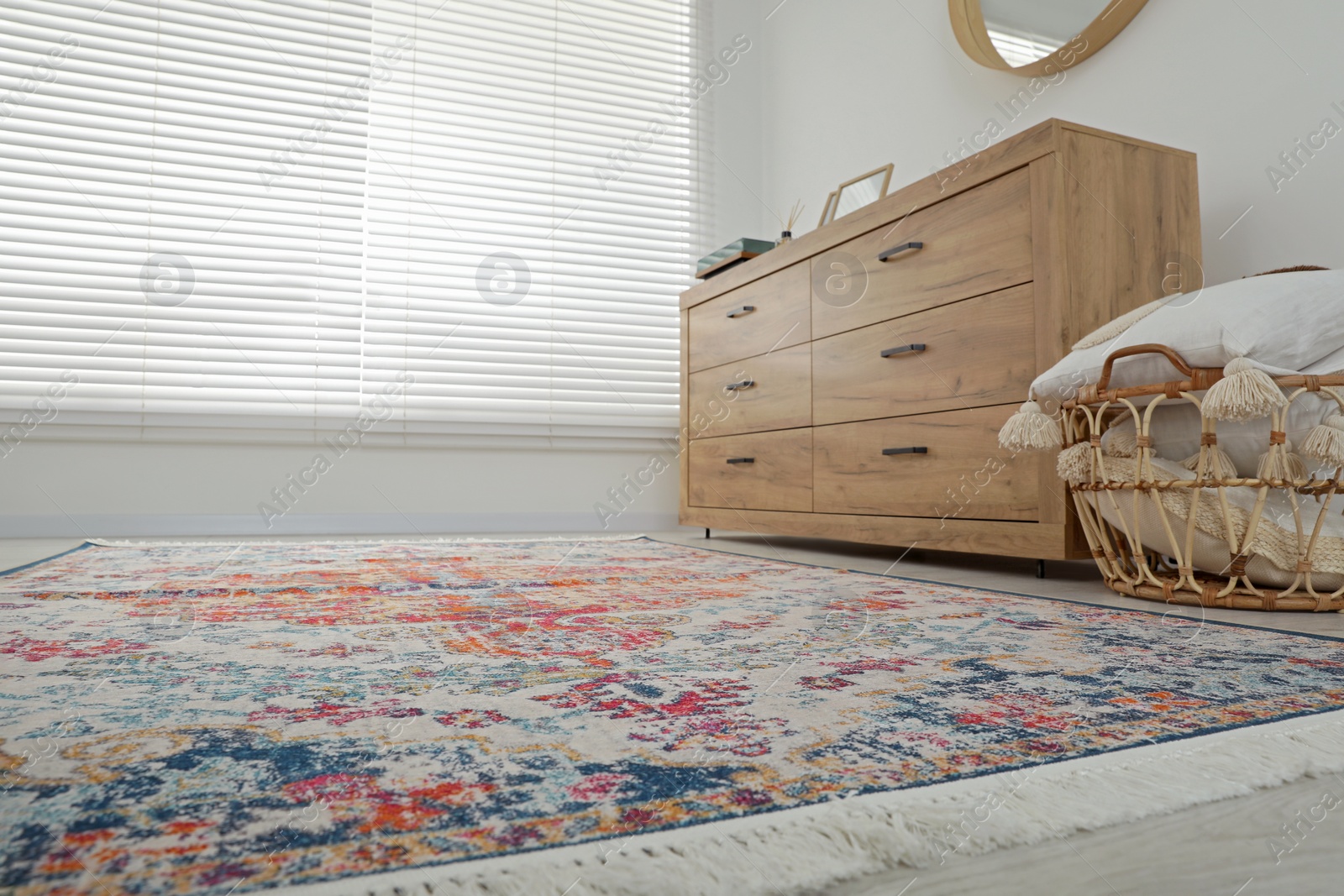 Photo of Stylish living room with beautiful carpet and furniture, low angle view. Interior design