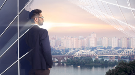 Image of Double exposure of businessman and cityscape with river