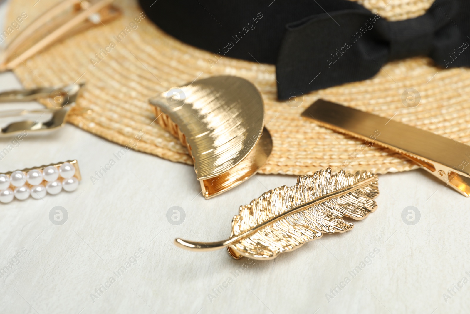 Photo of Beautiful different hair clips on white table
