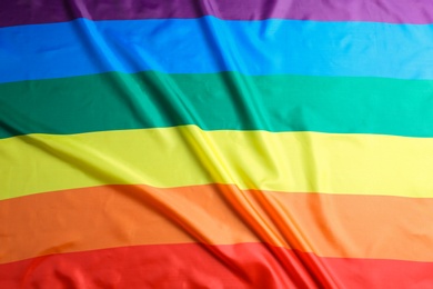 Photo of Bright rainbow gay flag as background. LGBT community